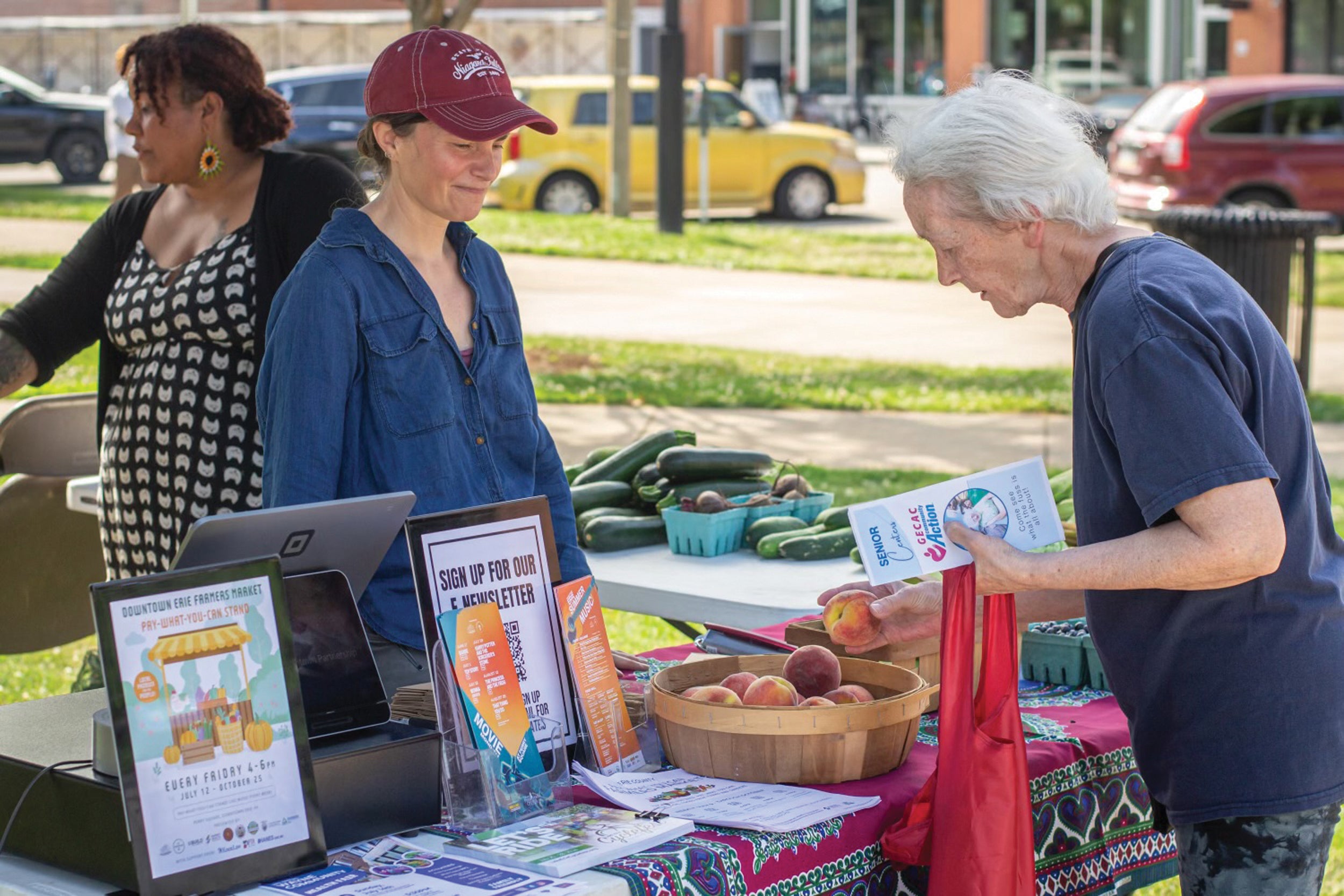 Northwestern Rural Electric Cooperative member Stephanie Thauer, center, started the Pay-What-You-Can Farmstand network to offer affordable locally grown produce in the region.